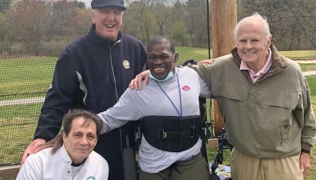 Fred Corcoran (right) and his co-founders of "Golf For All," Jerry Donovan (below, left) and Bob Beach (top, left) with one of their members, Ben, who is equipped into one of Jerry's "ParaGolfer" that helps brings the game to the disabled.